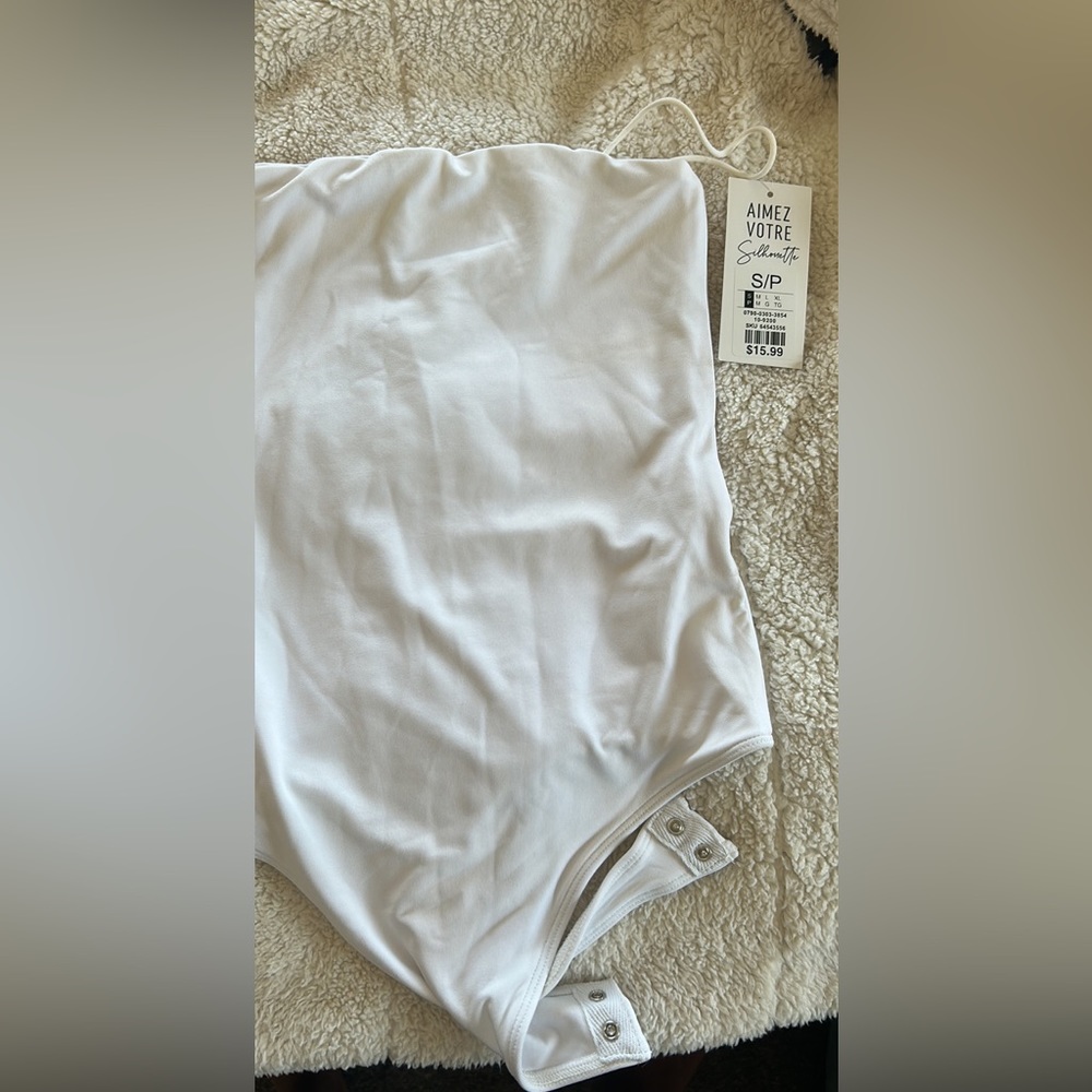 Sleeveless white bodysuit-